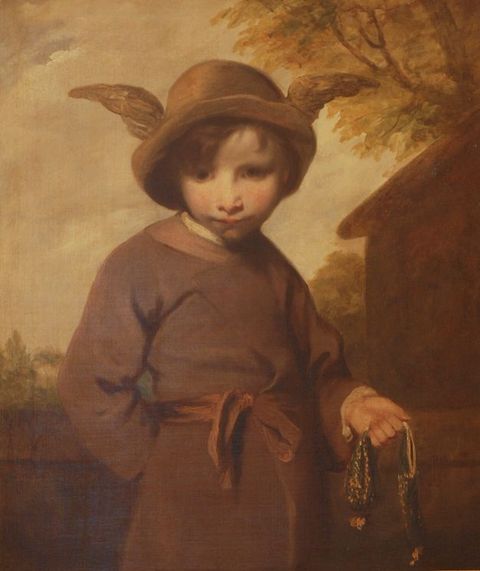 Painting. Shown from the hips up against a honey-toned landscape, a pale-skinned young boy wearing a winged brimmed hat stands with his belly swayed forwards and his head jutted out and down. Wide lips are shadowed over a delicate chin. One hand is behind his back and in the other, he holds a coin purse.
